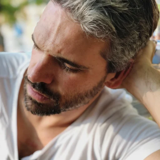 close-up-bearded-mid-adult-man-resting-outdoors